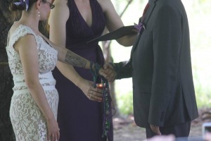 In this picture, I am blessing the handfasting cords with the Spirit of Fire. This was taken at Hilary Parry Haggerty and Dave Haggerty's wedding!